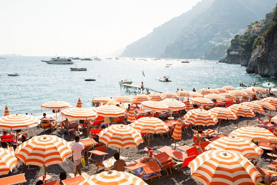 orange and white beach umbrellas on arienzo beach the amalfi coast by Carla Coulson