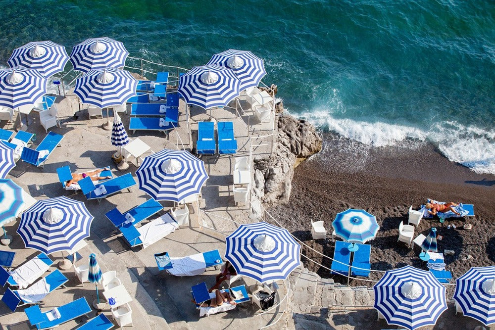 A fine art print of La Scogliera Beach Positano Sunbather on the Amalfi Coast by Carla Coulson  