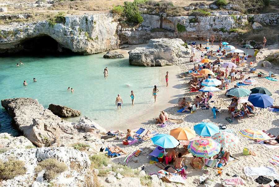 a pastel coloured fine art beach photo of cala del paradiso in monopoli puglia by carla coulson