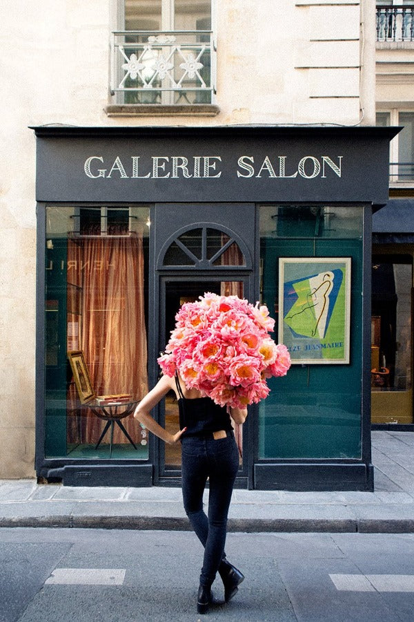 I Believe In Me is a photo of a girl in St Germain des Prés in Paris with a big beautiful bunch of peonies and is part of a limited edition series named Young Girl in Bloom by photographer Carla Coulson celebrating women loving and believing in themselves and building their self esteem by trusting their intuition.